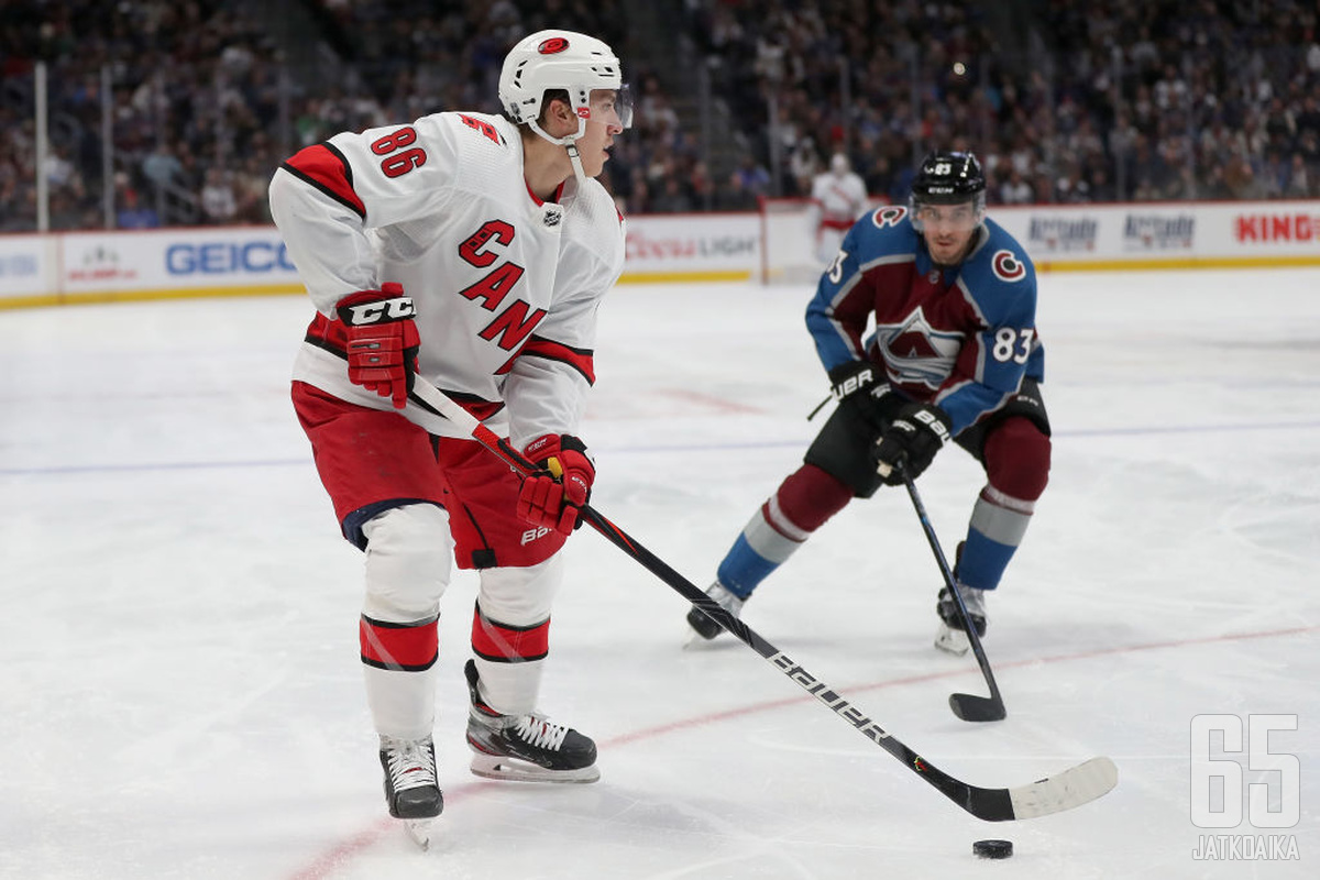 DENVER, COLORADO - DECEMBER 19: Teuvo Teravainen #86 of the Carolina Hurricanes looks for an opening against Matt Nieto #83 of the Colorado Avalanche in the third period at the Pepsi Center on December 19, 2019 in Denver, Colorado. (Photo by Matthew Stock